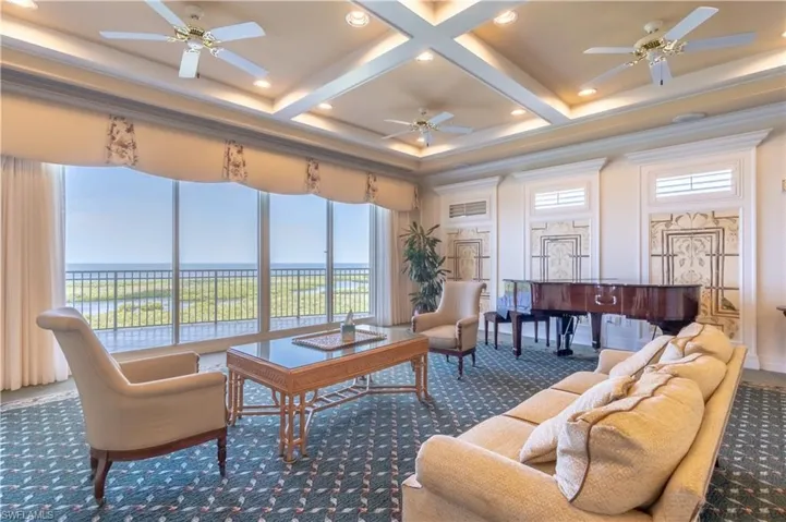 Top of the Pointe club room with piano and endless view out to the Gulf of Mexico