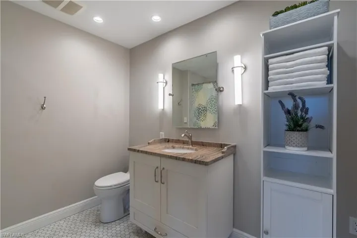 Guest bathroom with vanity and storage