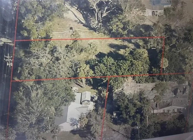 Aerial view of property's location featuring property parcel outlined