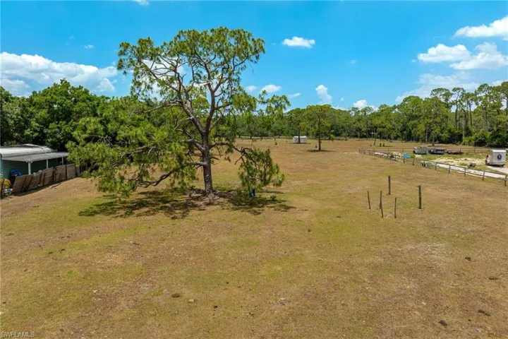 View of yard with a rural view