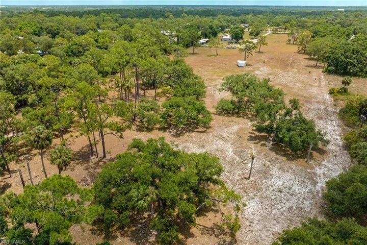 Birds eye view of property featuring a rural view