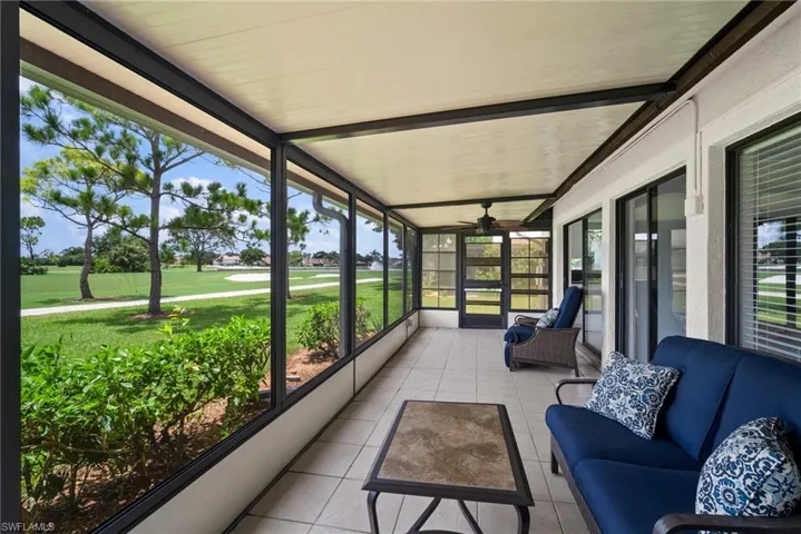 Sunroom with plenty of natural light and ceiling fan
