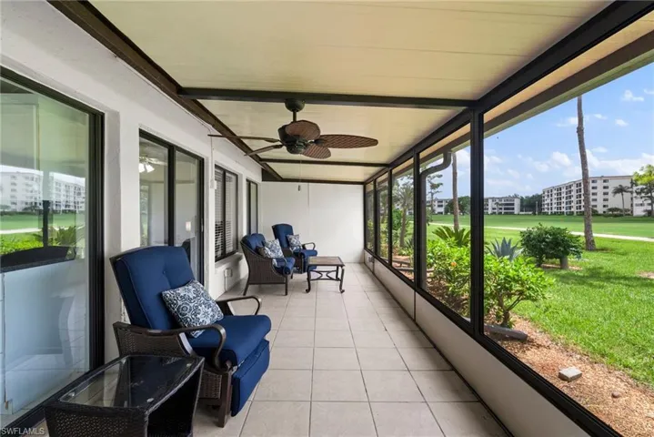 Sunroom / solarium featuring ceiling fan