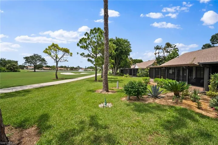 View of yard with a sunroom