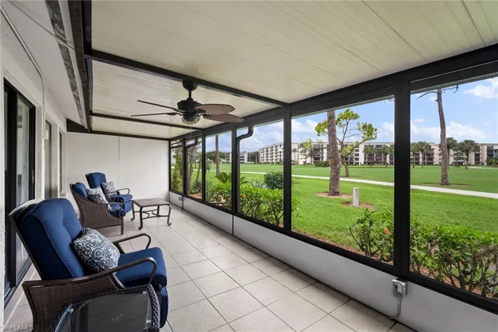 Sunroom featuring ceiling fan and a healthy amount of sunlight