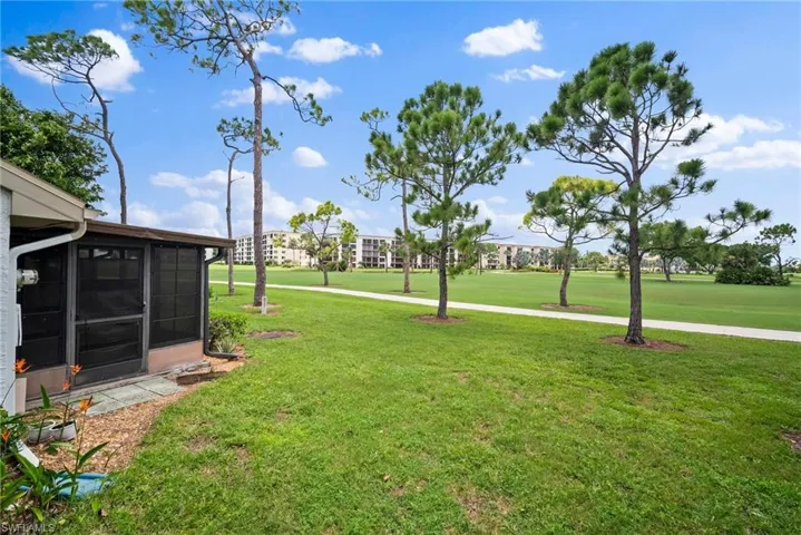 View of yard with a sunroom