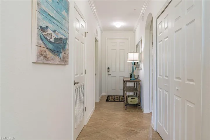 Foyer featuring ornamental molding
