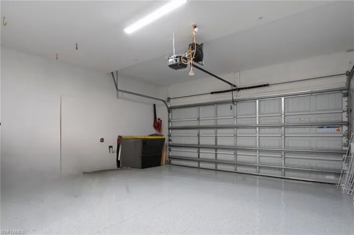 Garage featuring a garage door opener