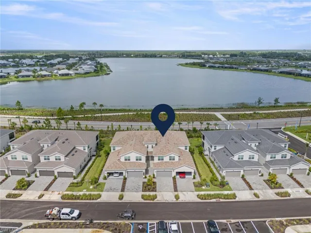 Aerial view of residential area with a large body of water