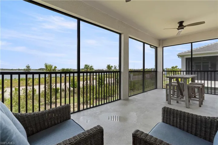 Sunroom / solarium featuring ceiling fan