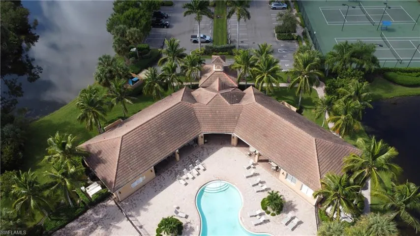 View of subject property featuring a pool