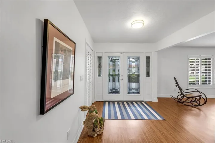 Screen Enclosed front Entry with French Doors.