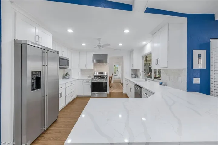 Newly renovated kitchen with Quartz countertops and marble backsplah
