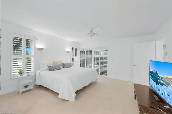 Primary Suite with Sliders and plantion shutters