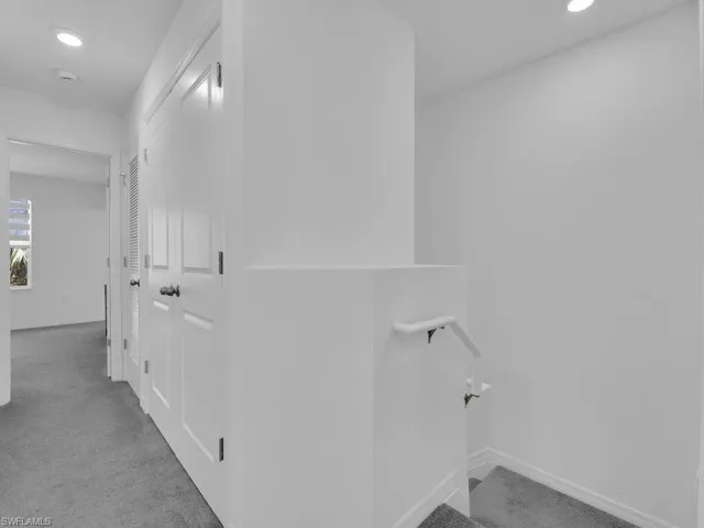 Corridor featuring recessed lighting, carpet, and baseboards
