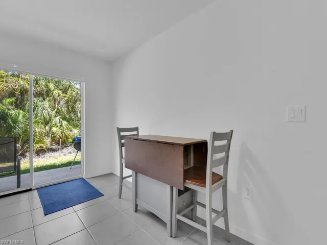 Dining area with tile patterned floors and baseboards