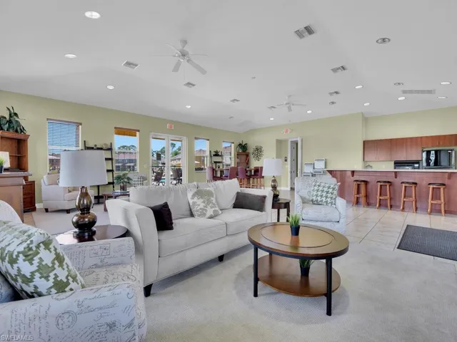 Living room featuring visible vents, recessed lighting, and a ceiling fan