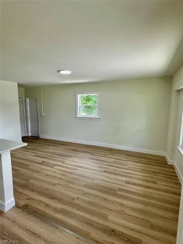 Unfurnished room featuring wood-type flooring