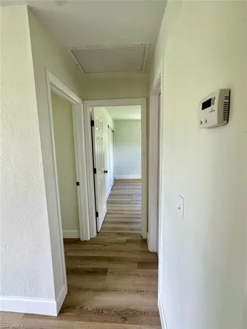 Hallway featuring hardwood / wood-style floors
