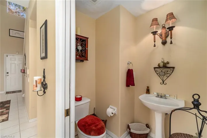 Bathroom with toilet and tile patterned floors