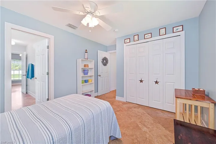 Bedroom featuring a closet and a ceiling fan