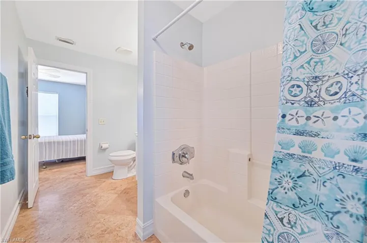 Full bathroom featuring ensuite bathroom and shower / bath combo