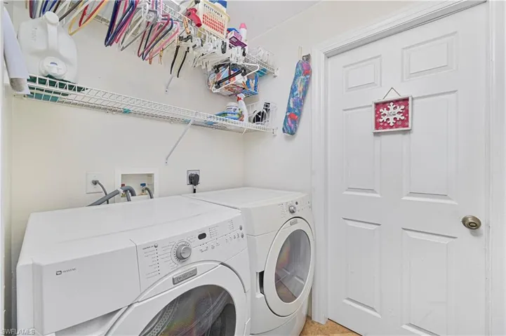 Washroom featuring washer and dryer