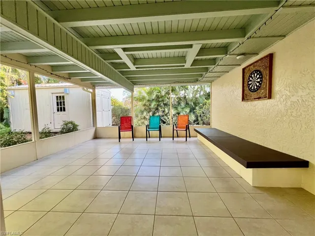 View of patio featuring an outbuilding