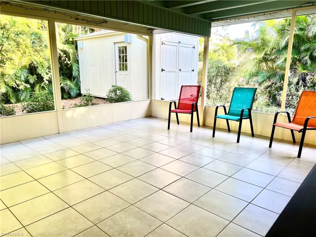 Unfurnished sunroom featuring a wealth of natural light