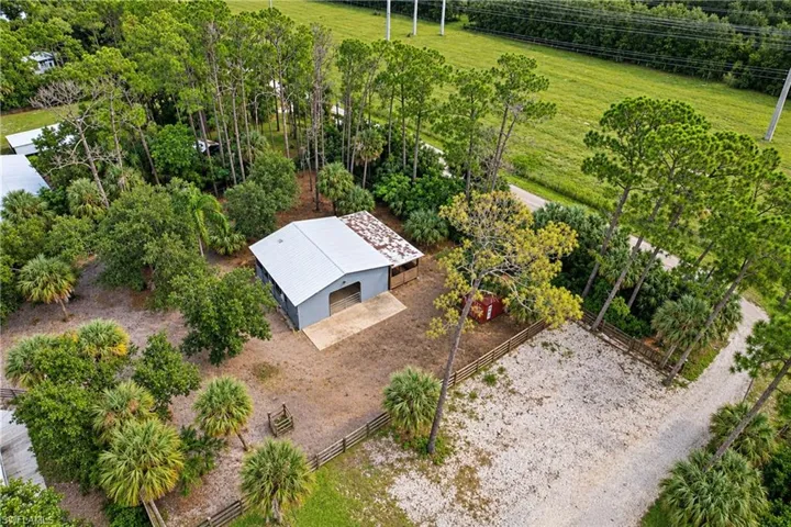 Detached structure with a metal roof and large bay door