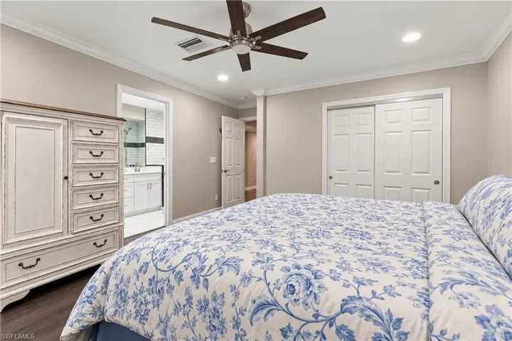 Recessed lighting, crown molding, wood-finish flooring, and a ceiling fan