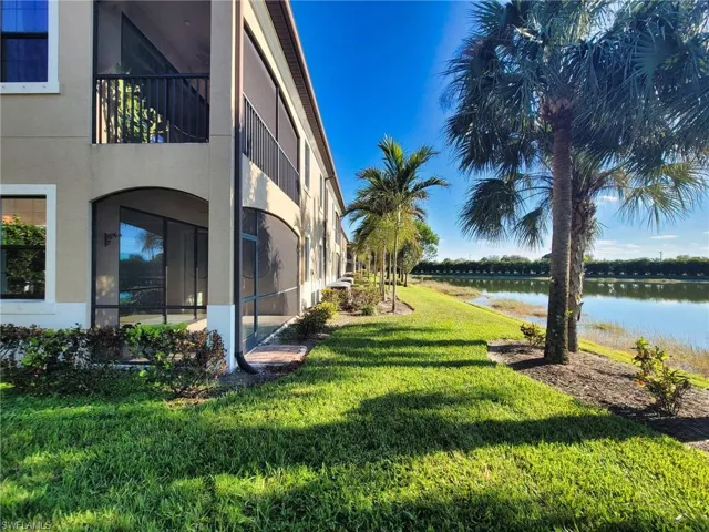 View of yard with a water view