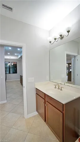 Bathroom featuring vanity and tile patterned floors