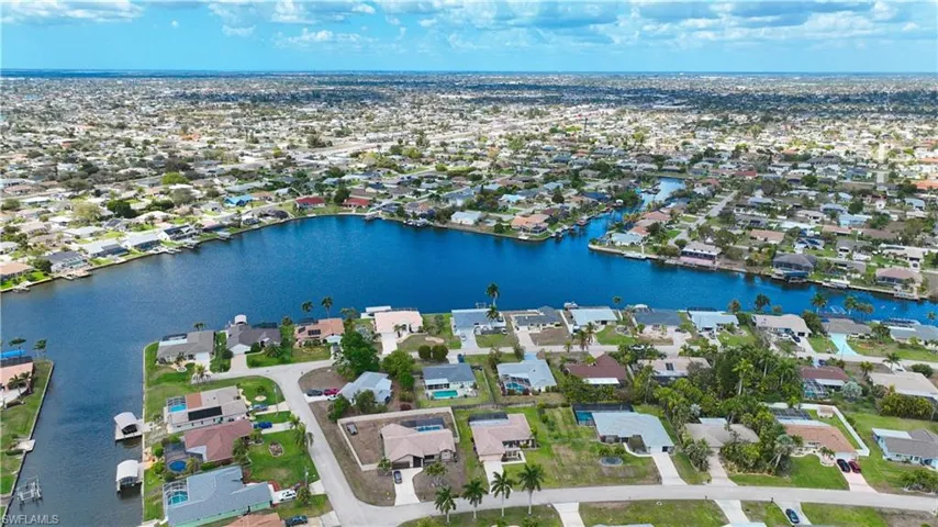 Aerial view of residential area with a nearby body of water