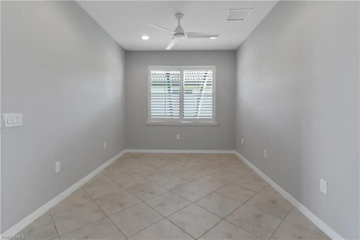 Spare room with light tile patterned flooring, recessed lighting, and ceiling fan