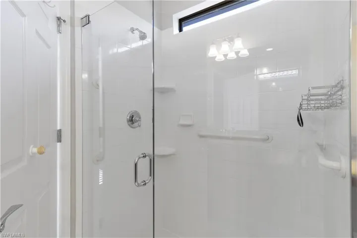 Full bath featuring a shower stall