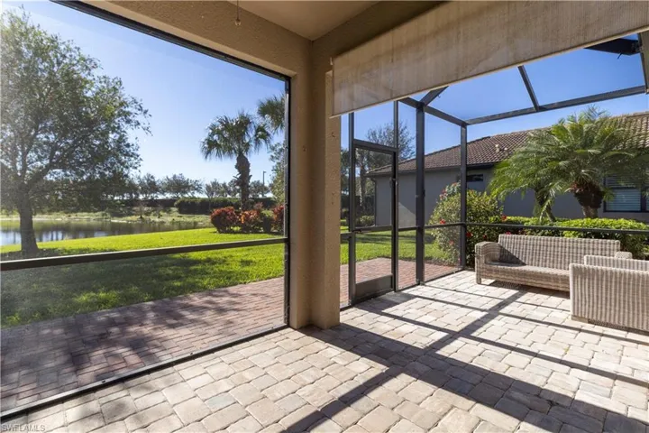Unfurnished sunroom featuring a water view