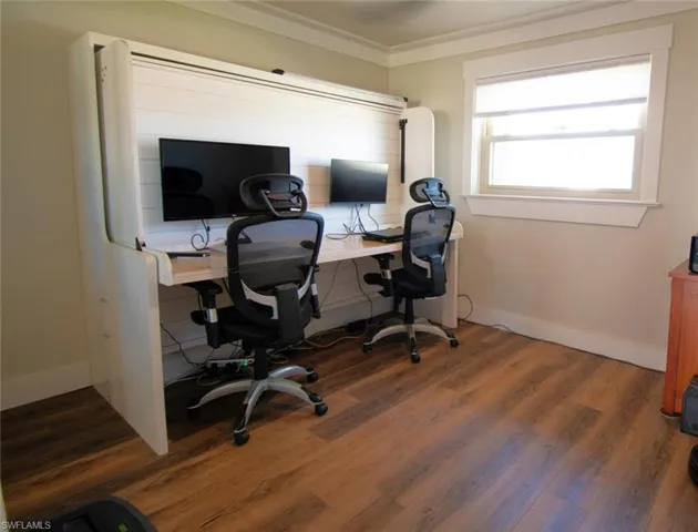 Custom murphy bed.  Laptops and monitors stay put!