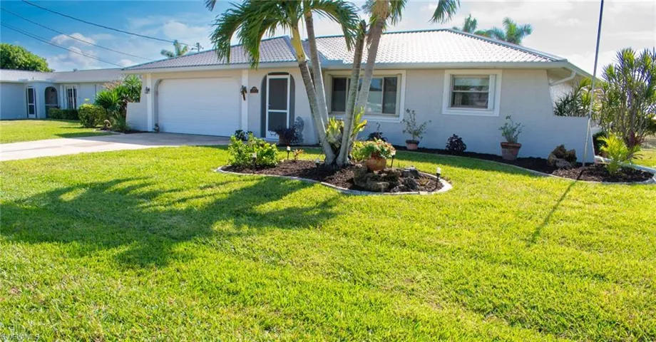 Newly sodded lawn in 2023 and landscaping in 2024.