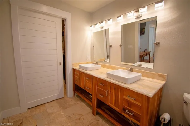 Bathroom with vanity and walkin closet