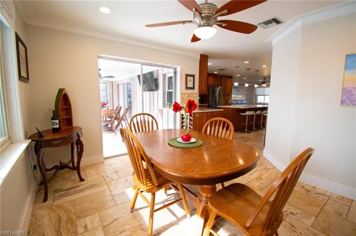 Dining view into kitchen and lanai