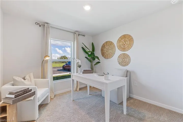 MODEL HOME - Home office featuring light carpet