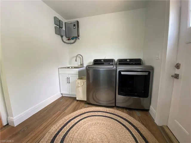 Tankless Water Heater, Laundry Sink, Washer and Dryer