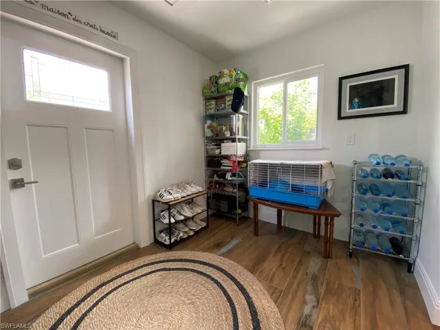 Laundry Room with storage and door to side patio