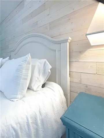 Bedroom with wooden walls