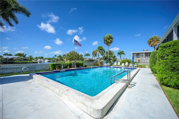 Community pool featuring a patio