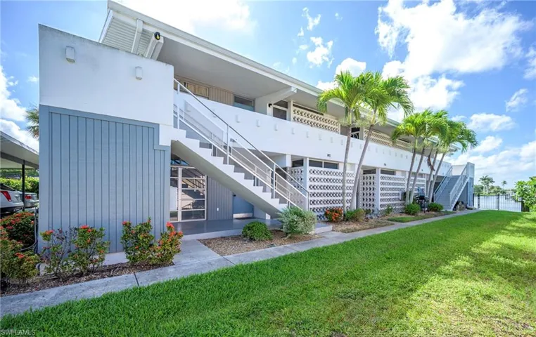 View of building exterior featuring stairway
