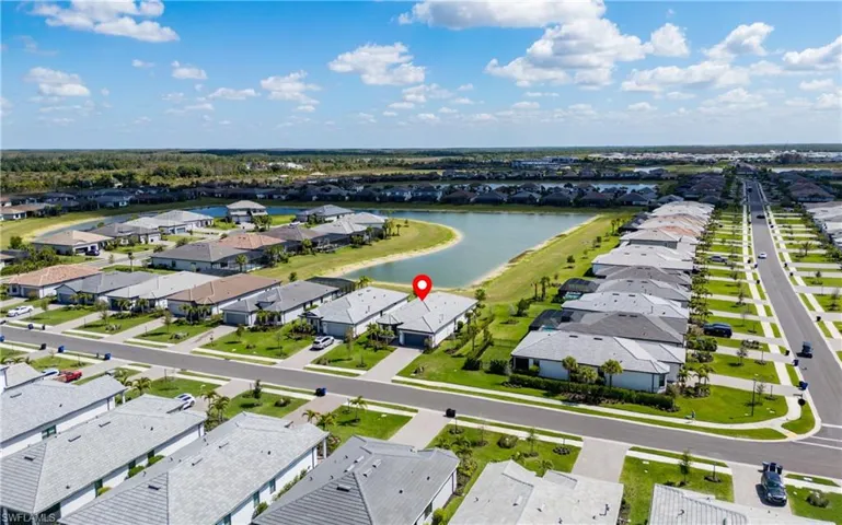Aerial view of residential area featuring a large body of water