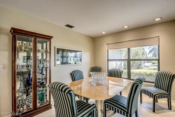 Dining area featuring light tile patterned floors
