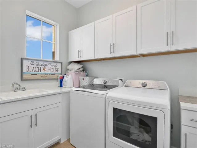 Laundry room with cabinet space and independent washer and dryer